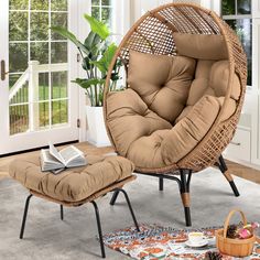 an egg chair and ottoman in a living room with a potted plant on the floor