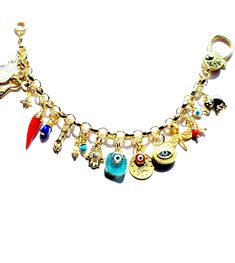 Colorful protective Evil Eye Charms and an Assortment of other Gold Vermeil Good Luck & protective charms bestow plenty of positive energy channeled unto this charm bracelet.  FOCAL EVIL EYE charm is bezeled in a Gold Vermeil oval setting with a beautiful GREEK KEY design surrounding its border & measures 15x10mm. 1 inch TURKISH COIN charm overlaid with 10 x 6 mm RED EVIL EYE charm  Adorable little HAMSA charm measures 15 x 10 mm   Beautiful 10 x 6 mm BLUE EVIL EYE overlaid on BLUE DRUZY STONE D Red Evil Eye, Protective Charms, Good Luck Charms, Oval Setting, Turkish Evil Eye, Hamsa Charm, Blue Evil Eye, Luck Charms, Eye Bracelet