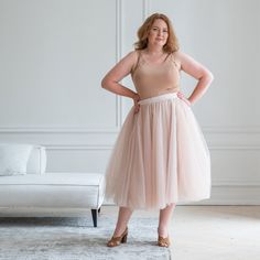 Step into a world of enchantment and grace with our Beige Tulle Skirt. Designed to make you feel like a true princess, this exquisite piece combines elegance, femininity, and a touch of whimsy for a truly magical experience. Our Beige Tulle Skirt is not just a skirt; it's a celebration of individuality and inclusivity. Available in plus sizes, we believe that beauty knows no boundaries and that every woman deserves to feel confident and beautiful. Embrace your curves and let this skirt embrace you with its flattering design and comfortable fit. With its midi length, our tulle skirt strikes the perfect balance between sophistication and playfulness. It's an ideal choice for various occasions, from weddings and special events to romantic evenings and whimsical photoshoots. You'll be the embo Beige Tulle Skirt, Tulle Skirt Plus Size, Tulle Skirt Women, Tulle Skirt Wedding, Adult Tulle Skirt, Long Tulle Skirt, Skirt Tulle, Plus Size Skirt, Tulle Midi Skirt