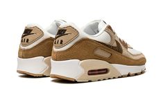 The Women’s Nike Air Max 90 “Snakeskin Swoosh” is a women’s-exclusive colorway of the classic running shoe that features earthy brown tones on its design.  As its name suggests, the “Snakeskin Swoosh” modifies the look of the Air Max 90 by swapping its original Swoosh logo with one made from an exotic brown snakeskin pattern.  A white mesh base forms the underlayer of the shoe while tan suede appears on the mid-panel and lower eyelets.  Elsewhere, a hairy brown suede mudguard matches the brown p Brown And Beige Sneakers, Brown Running Shoes, Nike Shoes Names, Brown Nikes, Tan Nike Shoes, Brown Sneakers Women, Nike Air Max 90 Se, Athletic Shoes Outfit, Tan Sneakers