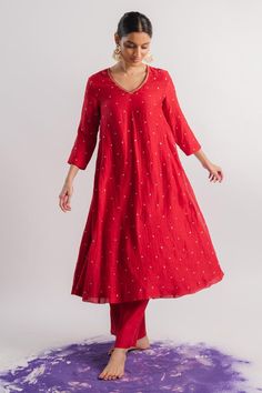 Red chanderi A-line kurta with sequins hand embroidery. Comes with straight pant.
Components: 2
Pattern: Hand embroidered
Type Of Work: Sequins
Neckline: V Neck
Sleeve Type: Three quarter
Fabric: Chanderi
Color: Red
Other Details: 
Note : Dupatta worn by the model is not for sale.
Occasion: Puja - Aza Fashions Festive V-neck Sets With Resham Embroidery, Diwali Palazzo Set With Zari Work And V-neck, Festive V-neck Sets With Mirror Work, Festive Chanderi V-neck Kurta, Festive V-neck Chanderi Kurta, Festive V-neck Embroidered Anarkali Set, Festive Embroidered V-neck Anarkali Set, Festive Straight Kurta Pant Set With Mirror Work, Festive Pant Set With Mirror Work And Straight Kurta