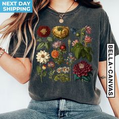 Cottagecore Shirt, Flower Shirt, Botanical Shirt, Vintage T shirt, Gardening Shirt, Aesthetic Shirt, Floral Tshirt, Plant Lover Shirt Cottage Core Shirt Welcome to BlueRidgeTee - Where Comfort Meets Style! Hello and a warm welcome to BlueRidgeTee! We're absolutely delighted to have you here. 💙 Elevate Your Wardrobe with our Premium, Soft, and Impeccably Crafted Shirts! Our shirts are not just shirts; they are a statement of quality. Clean, high-quality, and oh-so-soft, each piece is lovingly prepared by our dedicated team. Your Shopping Experience Matters! We value your time and trust, and it's our pleasure to assist you at any point. Have questions? Feel free to reach out! Finding Your Perfect Fit Women's sizes are tailored to be narrower at the waist. You may notice rolled-up sleeves in Flower Shirt Aesthetic, Strappy Backless Dress, Flower Graphic Tee, Backless Dress Summer, Cottagecore Shirt, Aesthetic Floral, Botanical Shirt, Shirt Aesthetic, Summer Fashion Beach