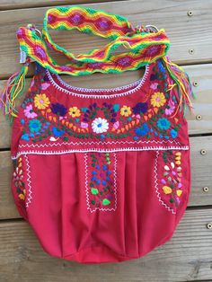 "**Small unlined bag** This is a beautiful embroidered bag handmade by Mexican Artisans With elegant multi-colored designs and patterns Each embroidered bag takes about 10 hours to make Straps are made with macrame technic The strap is long enough to wear as a simple over the shoulder or as a crossbody Every bag is unique, made by womwn artisans of San Gabriel Chilac, Puebla Excellent gift for any occasion Due to the hand made nature of this item the embroidered colors and patterns may vary **HA Bohemian Summer Pouch Hobo Bag, Bohemian Summer Hobo Bag In Pouch Shape, Summer Bohemian Hobo Pouch Bag, Artisan Embroidered Beach Bag, Bohemian Pink Crossbody Shoulder Bag, Handmade Bohemian Hobo Pouch Bag, Pink Bohemian Crossbody Shoulder Bag, Multicolor Woven Hobo Bag For Festivals, Bohemian Pouch Hobo Bag For Festivals