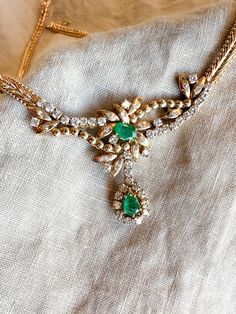 *Art Nouveau Necklace *14k Gold *Emerald, Genuine *Diamond, Natural *Emeralds, 0.85 carats *0.90 carat diamonds, 2.60 carats total  *17 inches *Circa 1960s ☞ Some fine jewelry items may show patina or signs of age or wear in photos. Rest assured, your jewelry will be carefully cleaned and polished prior to shipping! If you would like the natural patina left on, send us a note! Quality You Can Trust *Authenticated by a GIA Graduate Gemologist  *Detailed Quality Control and Careful Restoration *5 Star Customer Service. Questions? Send us a message! Timely Processing *Fast & Free Shipping! *Professional Ring Sizing in only 5-10 business days *Personalized Delivery for Gifts or Special Occasions Happiness, Guaranteed * 30 Day Returns and Exchanges More Vintage Jewelry ☞ JewelryOnRepeat.Etsy.co Green Diamond Necklace For Formal Occasions, Formal Green Hallmarked Diamond Necklace, Emerald Pear-shaped Wedding Necklaces, Emerald Pear-shaped Necklace For Wedding, Hallmarked Green Diamond Necklace, Dazzling Emerald Diamond Necklace For Anniversary, Fine Jewelry Hand-set Emerald Necklace For Anniversary, Fine Jewelry Emerald Necklace With 17 Jewels For Wedding, Dazzling Gold Emerald Necklace