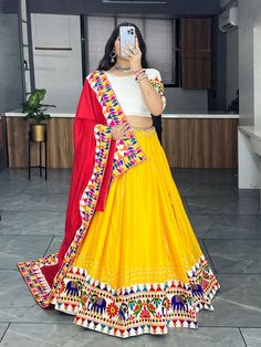 Celebrate Navratri in style with our exquisite Navratri Garba Lehenga Choli Set. This stunning traditional Indian outfit is designed to add a burst of color and elegance to your Navratri festivities. Featuring printed lehenga choli in heavy Butter silk. It has 4 mtr flair Skirt and blouse both are stitched.  Lehenga length is 40 to 42  inches. blouse is 34 to 42 inches Fitted Sharara With Multicolor Embroidery For Navratri, Art Silk Traditional Wear For Navratri, Bollywood Style Choli With Traditional Drape In Multicolor, Traditional Multicolor Lehenga For Navratri, Navratri Multicolor Saree-style Lehenga, Festive Choli With Multicolor Embroidery And Traditional Drape, Bollywood Style Festive Choli With Multicolor Embroidery, Bohemian Sets With Gota Work For Navratri, Fitted Multicolor Embroidered Sharara For Festivals