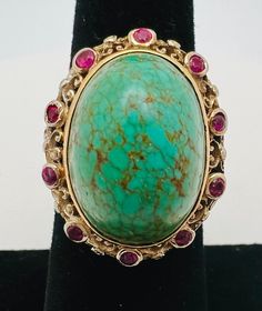 Antique 14K Yellow Gold Turquoise Ruby Cocktail Ring Size 6 A perfect gift for your loved one for any special occasion or holiday!  Total Ring Weight: 9.24g Ring Length: 31.76mm Ring Width: 19.08mm Ring Size: 6 Item will be placed in a gift box. * Antique Turquoise Gemstone Ring For Formal Occasions, Elegant Turquoise Gemstone Ring For Formal Occasions, Collectible Multi-stone Turquoise Oval Ring, Formal Fine Jewelry Turquoise Ring With Accent Stones, Formal Fine Jewelry Turquoise Cabochon Ring, Elegant Multi-stone Turquoise Gemstones, Elegant Gold Turquoise Cabochon Ring, Formal Turquoise Cabochon Ring Fine Jewelry, Elegant Yellow Gold Turquoise Ring For Formal Occasions