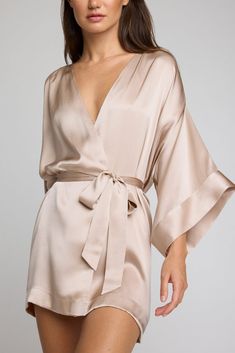 Luxurious and silky. This is elevated loungewear. A luxurious 100% silk kimono-style mini robe that drapes without effort and doesn't cling. *411* Use this as a guide. Preference is a huge factor — if you’re near the top of a size range and/or prefer more coverage, you may want to size up. Features a sleek drop kimono-inspired sleeve with a double cuff and light ruching on the shoulder for extra fullness. Short mini length. Finished with french seams, internal ties to hold garment in place, and Short Silk Robe, Silk Pijamas, Nye 2024, Elevated Loungewear, Silk Bathrobe, Silk Robes, Silky Robe, Silk Clothing, Mode Kimono