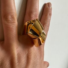 All of my rings are fun and sculptural and they start conversations. The Tied ring is made up of 2 interlocked sheets folded and cleverly connected. It's a light piece, but bold and voluminous and easy to wear. Around .5" wide at the bottom so it's comfortable on the finger, and about 1 3/8" wide across the top. It is about .5" high so it's not too high off the ring. Statement piece, hand fabricated in brass and finished in 14k nickel free gold. Gorgeous Jewelry, Statement Pieces, Ring Size, Sculpture, Brass, Ring, Gold