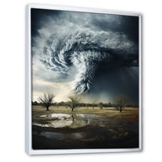 an image of a large tornado coming out of the sky over a field with trees