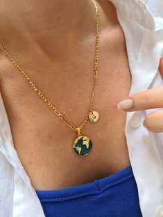 Earth Necklace, Blue Earth Pendant, Initial Letter World Map Jewelery, Personalized My World Charm, Minimalist Travel Necklace -24k Shiny Gold Plated World Pendant -18k Shiny Gold Plated Chain  -Letter (Gold Plated) -Pendant Size: 19 x 21 mm -Handmade necklace -Necklace  lenght: 50cm +5 cm extender chain (20 inches+2 inches extender chain) H O W TO O R D E R -Please specify the letter or letters you want when ordering. Example:  A,S or A,S,D  -And you can choose which chain you want. The World Map Necklace is the perfect accessory for you or somebody you love. You can wear the initials of your loved one or their children around your neck. It can be a great gift, especially for people who love travelling. -Your orders are sent with a gift package.  ★Do not spray on perfume or other sprays w