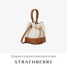 A modern take on the classic bucket bag, our best-selling osette is your perfect everyday companion. Deceptively spacious, the soft structure is handcrafted in spain and features an elegant drawstring closure, complete with our signature music bar. This compact yet versatile silhouette can be carried in hand by the leather top-handle, or styled as a crossbody bag with the detachable leather strap - for elegant ease in your everyday. Classic Bucket Bag With Detachable Strap For Travel, Everyday Bucket Shoulder Bag With Leather Handles, Luxury Everyday Bucket Bag With Top Handle, Brown Bucket Bag With Detachable Handle For Daily Use, Daily Top Handle Bucket Bag With Adjustable Strap, Elegant Hobo Bag With Detachable Strap For Everyday, Modern Beige Bucket Bag For Everyday, Everyday Bucket Bag With Top Handle And Adjustable Strap, Casual Leather Bucket Bag With Detachable Strap