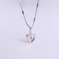 Introducing our Pink Glam Heart Necklace - crafted in Sterling Silver with a heart-shaped pink crystal at its core. This unique chain necklace features a sparkling pink crystal heart pendant, on a Sterling Silver heart shape base adding sophistication to any look. Wear it long or short with the adjustable clasp. Elevate your style with this enchanting piece that radiates love and glamour. Main Stone: heart shaped lab diamond Stone Color: pink Metal Material: 925 Sterling Silver Chain Lenght: 16 Pink Glam, Crystal Heart Pendant, Necklace Craft, 925 Sterling Silver Chain, Stone Heart, Metal Material, Crystal Heart, Sterling Silver Heart, Pink Crystal