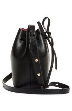 A coated, matte-patent lining creates colorful contrast on this extra-mini bucket bag made from textured Italian leather. Drawstring closure Adjustable push-stud strap Leather lining Leather Made in Italy Designer Handbags Chic Shoulder Bucket Bag With Snap Closure, Chic Bucket Bag With Snap Closure As Shoulder Bag, Formal Crossbody Bucket Bag With Adjustable Strap, Daily Use Bucket Bag With Gold-tone Hardware, Chic Coated Canvas Bucket Bag With Top Handle, Bucket Shoulder Bag With Snap Closure, Modern Bucket Bag With Snap Closure, Daily Use Bucket Bag With Snap Closure, Leather Bucket Bag For Evening