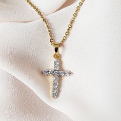 Our Medium Crystal Cross Necklace is the perfect statement piece to add just the right amount of sparkle to your outfit. MATERIAL: 24K gold plating; stainless steel; cubic zirconia crystals ✔ Non Tarnish ✔ Hypoallergenic ✔ Handmade ✔ Quality Guaranteed COLOR: gold Gold Dainty Crystal Necklace With Cubic Zirconia, Gold Dainty Cubic Zirconia Crystal Necklace, Dainty Gold Crystal Necklace With Cubic Zirconia, Gold Stainless Steel Jewelry With Diamond Accents, Dazzling Rhinestone Clavicle Necklace For Gift, Dazzling Rhinestone Clavicle Necklace As Gift, Gold Cubic Zirconia Pendant Cross Necklace, Gold Cubic Zirconia Crystal Pendant Necklace, Gold Cubic Zirconia Cross Pendant Necklace