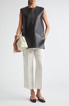 Elin Kling and Karl Lindman bring forth another capsule-wardrobe essential in sharply creased trousers boasting a straight-leg silhouette cropped at the ankle. 24 1/2" inseam; 18" leg opening; 11" front rise; 15" back rise (size 0US/32EU) Zip fly with hook-and-bar closure Side-seam pockets 78% viscose, 22% polyester Dry clean Made in Portugal Designer Clothing Structured Office Pants With Pressed Crease, Modern Structured Pants For Workwear, Classic Structured Pants For Workwear, Classic Structured Work Pants, Chic Structured Bottoms With Pressed Crease, Formal Straight Silhouette Bottoms For Spring, Formal Spring Bottoms With Straight Silhouette, Classic Structured Bottoms For Spring, Sleek Spring Pants With Straight Hem