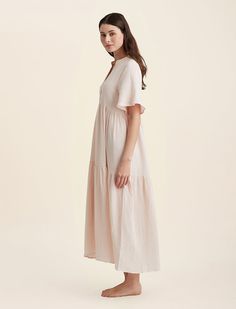 Our most beautiful textured cotton yet, perfect to take you to bed or lounge around the water. Our Ashley styles will be your favorite all Summer long!• 100% Cotton• Breathable• Button placket neckline• Short flutter sleeve• Soft pleating along tiers• Maxi nightdress (130cm in length size S)Our model is a size US4 and wears a small in these images. Spring V-neck Dress For Relaxation, Cotton Beach Nightgown With Ruffles, Beach Nightgown With Ruffles In Cotton, Summer Dresses With Relaxed Fit For Casual Wear, Relaxed Fit Summer Dresses For Relaxation, Feminine Beach Nightgown For Summer, Summer Beach Nightgown With Short Sleeves, Feminine Summer Nightgown For Vacation, Feminine V-neck Nightgown For Beach