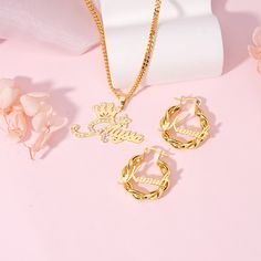 Delight your little ones with this enchanting set of personalized jewelry. The gold plated crown name necklace is custom-made with their name, adorned with a regal crown, adding a touch of royalty to their everyday look. Paired with adorable mini hoop earrings, this set offers a perfect blend of elegance and fun, designed especially for kids.  Material: Copper.  Color: Gold. Necklcae Chain Length: 14",16",18",20",22". Earrings Diameter: 22mm.  Process: Gold plated. Jewelry Type: Name Necklace, N Gold Necklace Chain, Name Earrings, Mini Earrings, Mini Hoop Earrings, Baby Jewelry, Hoop Earring Sets, Custom Name Necklace, Gold Crown, Copper Color