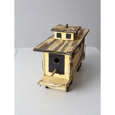 a small bird house made out of wood