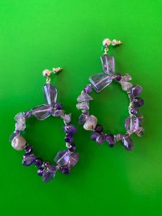 "Smooth and faceted Amethyst stones in various sizes wrapped on sterling silver hoop. Length 3\" Hoop 1 3/4\" wide" Purple Amethyst Hoop Jewelry, Purple Amethyst Gemstone Chandelier Earrings, Statement Chandelier, Hoop Dangle Earrings, Statement Chandeliers, Amethyst Stones, Sterling Silver Hoops, Amethyst Stone, Silver Hoops