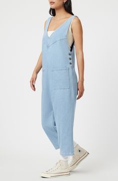 Rock a casual-cool vibe in this lightweight denim jumpsuit designed with front patch pockets and a cropped length. 23 1/2" inseam; 17 1/2" leg opening Side button closure Deep V-neck Sleeveless Front patch pockets 76% cotton, 24% rayon Machine wash, dry flat Made in Turkey Georgia Dress, Light Well, Designer Jumpsuits, Dressy Pants, Denim Romper, Dressy Dresses, Dress Crafts, Rock A, Luxury Linen