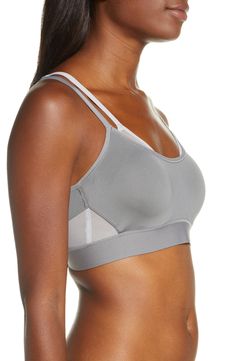 With the support of two sports bras in one, this lightweight style that wicks away moisture is perfect for cardio or running. Memory-foam straps and a wide elastic bottom band help the design stay put while mesh cutouts give you breathable comfort. Light foam cups give shape and projection Underwire 85% CoolMax® polyester, 15% Lycra® spandex Hand wash, line dry Imported Lingerie Supportive Strappy Sporty Activewear, Supportive Strapped Sporty Activewear, Sporty Nylon Activewear With Straps, Gray Nylon Sports Bra For Sports, Gray Nylon Sports Bra, Breathable Gray Nylon Sports Bra, Supportive Athleisure Sports Bra With Straps, Nylon Sports Bra With Straps, Gray Compression Sports Bra In Nylon