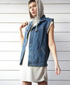 Unisex vintage blue denim sleeveless jacket casual biker style vest. Front button closure, two side pockets, shoulder tabs, no lining. Material is 100% cotton. Made in Britain. Size M on tag. Measured laying flat (please double for circumference): 25'' / 63.5 cm long 20.5'' / 52 cm armpit to armpit 19'' / 48 cm waist Great vintage condition. Cheap Denim Blue Workwear Vest, Cotton Denim Vest With Pockets For Fall, Casual Sleeveless Denim Vest With Pockets, Fall Sleeveless Denim Vest With Pockets, Casual Washed Blue Denim Vest With Pockets, Casual Cotton Denim Vest With Pockets, Spring Cotton Denim Vest With Pockets, Sleeveless Denim Vest For Spring Streetwear, Urban Style Denim Vest With Pockets For Spring