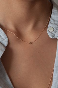 A dainty every day fine jewelry necklace - you'll love to keep on. Simple minimalistic jewelry. Details: Solid 14k Gold dainty cable chain Solid 14k 4mm Ball Solid 14k spring ring clasp #minimalistjewelry #daintynecklace #goldnecklace #ballnecklace #simplenecklace Everyday 14k Gold Round Beads Necklace, Delicate Hypoallergenic Charm Necklaces, Everyday Delicate Hypoallergenic Charm Necklace, Dainty Everyday Charm Necklaces In 14k Gold Filled, Dainty 14k Gold Filled Charm Necklaces For Everyday, Simple Everyday Necklace With Delicate Chain, Dainty 14k Gold Hypoallergenic Necklace, Dainty Hypoallergenic 14k Gold Necklaces, Dainty Hypoallergenic 14k Gold Necklace