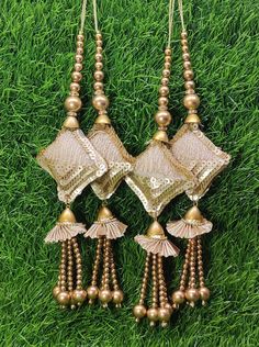 Indian Handmade Gold Latkan for Saree Blouse Lehenga HandBags Dupatta Decoration Bridal Wedding dress for Women pair of 2 pcs Size - 21.0 cm Length  Item Description You can use this Beautiful pair of tassle for several DIY projects.  *These beautiful Tassel Latkans are used as the accessory for saree blouse on the back, but u can use according to your need and your innovative ideas. * Package contains 2 Latkan / 1 Pair Other Than Saree Blouse, you can use these latkans in various ways Craft Projects Designing Home Decoration Festive celebrations. Evening and party Apparels. Home décor items Apparel & Fashion Scarves n Stoles Headband, hats Table cover, curtains, Pillow covers, Cushion cover Shoe designing Headband, hats Table cover, curtains Designing stylish blouses Ship From New Delhi, Women's Blouse Piece With Latkans For Traditional Ceremonies, Luxury Gold Necklaces With Latkans, Luxury Chandbalis With Latkans, Luxury Jewelry With Latkans For Rituals, Latkan Tassels Blouses Big And Heavy Accessories, Luxury Saree With Latkans For Festivals, Cheap Gold Chandbalis With Latkans, Luxury Latkans Necklace For Wedding, Luxury Latkans Necklaces For Women