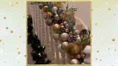 a christmas garland with pine cones, balls and evergreens on the banister rail