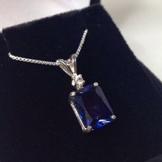 "Beautiful Blue & White Sapphire Pendant Necklace * 4ct Emerald Cut Blue Sapphire measures 10mm x 8mm * Brilliant Cut White Sapphire Accent measures 2.5mm * 4.1cts total gemstone weight * 14k White or Yellow Gold * 18\" Sterling Silver link Chain Included Hallmarked & Gift Ready! Matching Earrings & Ring Also Available! This 4ct Sapphire is Laboratory Grown & is identical to natural in every way, including Chemistry, Composition & Hardness with Excellent Clarity & Color R Classic Cubic Zirconia Gemstones For Formal Events, Formal Sapphire Diamond Necklace With Brilliant Cut, Classic Sapphire Gemstones With Accent Stones, Sapphire Gemstones Fine Jewelry Gift, Sapphire Gemstones For Gifts, Fine Jewelry, Formal Sapphire Necklace With Brilliant Cut, Sapphire Pendant With Diamond Cut, Elegant Sapphire Gemstones With Brilliant Cut, Elegant Brilliant Cut Sapphire Gemstones