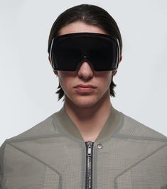 Shield oversized sunglasses Rick Owens Glasses, Futuristic Sunglasses With Mirrored Lenses For Streetwear, Futuristic Mirrored Sunglasses For Streetwear, Rick Owens Sunglasses, Futuristic Shield Sunglasses With Uva Protection, Futuristic Polarized Sunglasses For Outdoor Use, Sleek Black Shield Sunglasses With Uva Protection, Modern Black Sunglasses For Protection, Black Futuristic Shield Sunglasses For Outdoor