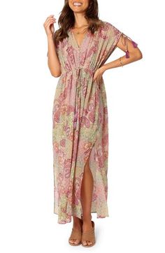 Beautifully patterned fabric is perfectly draped and cinched at the waist of this versatile maxi dress finished with knee-high slits for easy movement. Front button-and-loop closure V-neck Cap sleeves Tie belt 100% polyester Hand wash, dry flat Imported Bohemian V-neck Maxi Dress With Side Slits, Chic Maxi Dress With Side Slits For Beach, Bohemian Floor-length Dress With Side Slits, Tie Waist Sundress Maxi Dress, Sundress Maxi Dress With Tie Waist, Sundress Style Maxi Dress With Tie Waist, Bohemian V-neck Dress With Side Slits, Beach Cover-up Maxi Dress With Side Slits, Maxi Length Beach Cover-up Dress With Side Slits