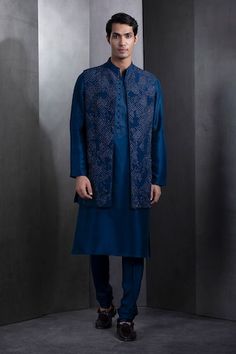 Prussian blue sleeveless longline bundi crafted in silk fabric with all over sequin helix galaxy embroidery. - Aza Fashions Festive Sleeveless Blue Kurta, Fitted Silk Nehru Jacket Straight Kurta, Fitted Silk Nehru Jacket, Blue Sleeveless Kurta For Festive Occasions, Festive Blue Sleeveless Kurta, Blue Formal Outerwear For Eid, Elegant Blue Outerwear For Eid, Traditional Sleeveless Blue Kurta, Wedding Blue Silk Sherwani