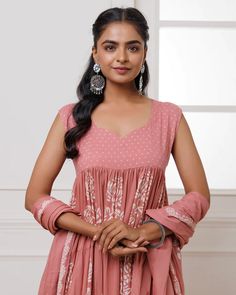 This coral mul-mul anarkali set is perfect for adding a pop of color to any occasion. Hand block printed for an exquisite finish, it features delicate lace work and a matching dupatta adorned with tassels. Crafted for both elegance and comfort, this set is the perfect addition to your wardrobe. No. of pieces - 3 piece set. Color - Coral. Fabric - Mul-Mul. Washing Instructions - Dry Clean. Pink Anarkali Kurta With Block Print, Pink Anarkali Set With Block Print Straight Kurta, Pink Block Print Unstitched Anarkali Set, Traditional Pink Anarkali Set With Block Print, Pink Anarkali Set With Block Print, Pink Block Print Anarkali Set, Anarkali Style Block Print Palazzo Set For Wedding, Wedding Anarkali Salwar Kameez With Block Print, Eid Bandhani Print Mulmul Anarkali Set