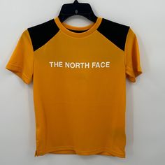 The North Face Boy's Never Stop Tee In Summit Gold Size Large New With Tags-Small Stain On Sleeve (See Picture, Washing Will Remove It) Please Feel Free To Ask Any Questions Before Purchasing Thank You! Yellow Sports T-shirt With Logo Print, Black The North Face Crew Neck T-shirt, The North Face Black Crew Neck T-shirt, The North Face Black Casual T-shirt, Black Crew Neck T-shirt By The North Face, Casual Black The North Face T-shirt, Black Casual T-shirt By The North Face, Casual Black T-shirt By The North Face, Yellow Sporty T-shirt With Letter Print