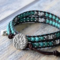 Genuine leather and turquoise Howlite stones make up this classic boho style, double wrap bracelet. Always a favorite for it's versatility and simplicity ~ and when you think bohemian, you think turquoise! This wrap includes pretty matte silver hematite and sparkly clear crystal accents. Turquoise looks gorgeous on every skin tone. Give it a try and enjoy the versatility. 4mm (.157") diameter turquoise Howlite gemstones Silver finished tea leaves motif button, about 15mm (.59") in diameter Ombre Adjustable Turquoise Wrap Bracelet For Festival, Turquoise Hand Wrapped Wrap Bracelet, Classic Boho Style, Turquoise Wrap Bracelet, Logo Heart, Boho Wrap Bracelet, Ombre Brown, Double Wrap Bracelet, Howlite Stone