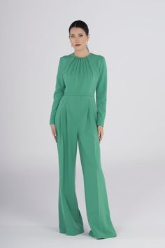 Elevate your style with our Chic Green Jumpsuit, designed for those special occasions where elegance is a must. The pleated-wide leg trousers add a touch of sophistication, making it perfect for proms, weddings, and any other memorable event. Elegant Pleated Jumpsuits And Rompers For Party, Elegant Fitted Jumpsuit For Wedding Guest, Elegant Green Evening Pantsuit, Elegant Long Sleeve Suits For Gala, Formal Fitted Full-length Jumpsuit/romper, Elegant Fitted Pleated Jumpsuits And Rompers, Pleated Fitted Jumpsuits And Rompers For Party, Elegant Fitted Jumpsuits And Rompers For Wedding, Fitted Long Sleeve Jumpsuits And Rompers For Wedding