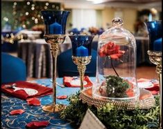 the table is set with blue candles and red napkins