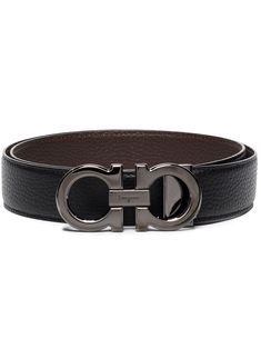 Black/brown leather reversible Gancini buckle belt from SALVATORE FERRAGAMO featuring Gancini buckle, front buckle fastening, reversible and punched holes. Modern Business Belts, Modern Leather Belts With Buckle Closure, Modern Leather Belt With Buckle Closure, Luxury Belts With Buckle Closure For Formal Occasions, Luxury Formal Belt With Buckle Closure, Timeless Black Belt, Luxury Business Belts With Buckle Closure, Designer Belts With Buckle Closure For Business, Black Formal Belt With Buckle Closure