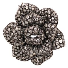 Gorgeous vintage diamond rose brooch in 18K white. This is a stunning brooch of a rose covered in fancy gray round diamonds in a beautiful 3D design. The diamonds are pave' set covering all the rose petals. A total of 8.80 carats of round fancy gray diamonds. This is a large brooch measuring approximately 2 iches in diameter. This brooch is designed in beautiful details and the workmanship of the piece is magnificent. The brooch is crafted in 18k white gold with black rhodium plating. The Brooch is stamped "750" "18K" on the back. The total weight of the brooch is 31 grams. This is a vintage designer brooch, pre-owned Brooch in excellent condition, made in Italy. Brooch Specifications: Brand: Assor Gioielli Metal: 18K White Gold Finish: Black Rhodium Plating over 18K Gold Brooch Diameter: Luxury White Flower Brooch, Luxury White Flower Brooches, Gray Diamond, Rose Brooch, Set Cover, Indian Wedding Jewelry, Grey Diamond, Gold Brooches, Black Rhodium