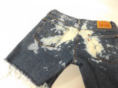 vintage 90s levi cut off blue jean shorts. distressing throughout with raw frayed bottom hem. W 33 on the tags but waist is a comfortable 34 inch waist, see measurements. LABEL || levi strauss and co. MATERIAL || cotton denim CONDITION || great distressed || ready to wear MEASUREMENTS || in inches size || W 33 on tags outside length waist to bottom || 15 1/2 inseam length || 6 rise || 10 waist lying flat doubled || 34 hips lying flat/doubled || 44 ~~see more shorts here www.etsy.com/shop/roadkil Acid Wash Denim Cutoff Shorts, Denim Cutoff Shorts For Festivals, Cutoff Denim Shorts For Festival, Bleached Denim Cutoff Jean Shorts, Bleached Cutoff Cotton Jean Shorts, Festival Cutoff Jean Shorts With Frayed Hem, Relaxed Fit Cutoff Grunge Shorts, Faded Distressed Jean Shorts For Summer, Summer Distressed Faded Jean Shorts