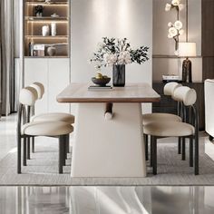 a dining room table with chairs and a vase filled with flowers on top of it