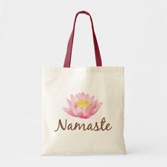 a tote bag with the name namaste on it and a pink flower