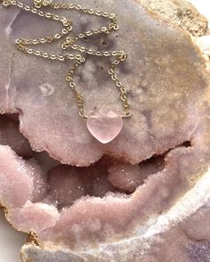 A beautiful heart shaped Rose quartz Crystal has been made into a pendent and placed on a delicate Sterling silver or 14k gold filled chain. 10mmThese rose quartz necklaces are so soft and feminine- with loving calm energy emitting from each stone, and speaking directly to your heart chakra-this will make the perfect addition to you jewelry collection. Handcrafted Raw Rose Quartz Pendant Necklace• Beautiful Raw Crystal jewelry gift • Inspires Love • High quality genuine rose quartz • Raw stones offer stunning unique characteristics• Your choice of chain — sterling silver or 14k gold• Choose the length you’d like — 16, 18, or 20"• Delivered in a luxurious pink velvet jewelry bagUNIQUELY YOURS Your necklace will be made to order and will look similar to the photo above. Because it’s one-of-a Elegant Rose Quartz Necklace Gift, Rose Quartz Heart Necklace, Pink Rose Quartz Crystal Necklace, Heart Shaped Rose, Rose Quartz Heart Pendant, Calm Energy, Pink Rose Quarts Necklace, Pink Rose Quartz Heart Pendant Jewelry, Rose Quartz Necklace Pendants