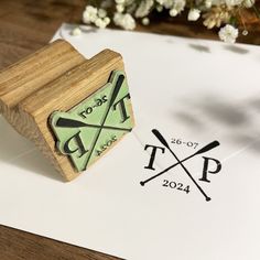 a rubber stamp with the words to do list and two crossed oars on it