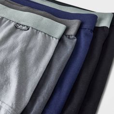 Stay relaxed and comfortable all day and all night with this 5-Pack Classic Trunks from Goodfellow & Co™. Designed in a comfort fit with added support and featuring a tagless design, these boxer briefs are made from a soft and stretchy fabric for all-day and all-night comfort. This pack includes four pairs in solid gray, charcoal gray, black and blue hues to add variety to your underwear drawer. Goodfellow & Co™: Where style & fit are always in good company. Casual Solid Boxer Briefs With Comfort Waistband, Solid Color Multi-pack Boxer Briefs For Loungewear, Casual Solid Color Boxer Briefs For Loungewear, Solid Multi-pack Boxer Briefs For Loungewear, Black Bottoms With Comfort Stretch And Soft Touch, Cotton Sports Bottoms With Soft Touch, Casual Stretch Boxer Briefs With Comfort Waistband, Casual Snug Fit Cotton Bottoms, Sporty Solid Color Bottoms Multi-pack