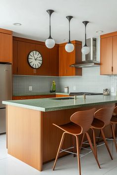 a kitchen with wooden cabinets and green counter tops