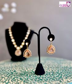 Enhance your ensemble with our Peach Stone and Kundan Necklace Set - a luxurious accessory fit for any occasion! Crafted with top-notch materials, it brings a touch of sophistication to your appearance. Its impeccable design ensures a secure and comfortable fit. Elevate your fashion game with our Peach Stone and Kundan Necklace Set now. Fancy Clutch, Pleated Saree, Bangle Box, Kids Wear Girls, Kundan Necklace Set, Silk Saree Banarasi, Block Print Saree, Fancy Gowns, Silk Thread Bangles