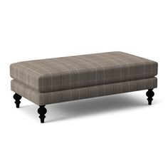 the footstool is made out of wood and has a plaid pattern on it