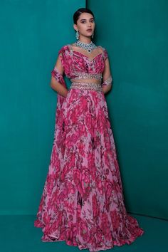 Pink digital floral print georgette lehenga with silver zari, badla and sequin embroidery. Paired with a printed and embroidered blouse, dupatta and waistbelt.
Components: 4
Pattern: Printed, Embroidered
Type Of Work: Zari, Sequin, Badla
Neckline: V Neck
Sleeve Type: Cap
Fabric: Georgette
Color: Pink
Other Details: 
Padded blouse
Attached cancan
Approx. product weight: 4 -5 kgs
Length:
Lehenga: 46 inches
Blouse: 15 inches
Occasion: Mehendi and Haldi - Aza Fashions Elegant Floral Print Lehenga With Traditional Drape, Diwali Floral Print Georgette Sets, Navratri Floral Print Georgette Sets, Bollywood Style Floor-length Floral Print Set, Designer Georgette Sharara With Digital Print, Georgette Choli With Floral Print And Traditional Drape, Designer Digital Print Georgette Sharara, Floral Print Georgette Choli With Traditional Drape, Elegant Semi-stitched Floral Print Choli